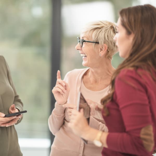 Two women in a friendly conversation
